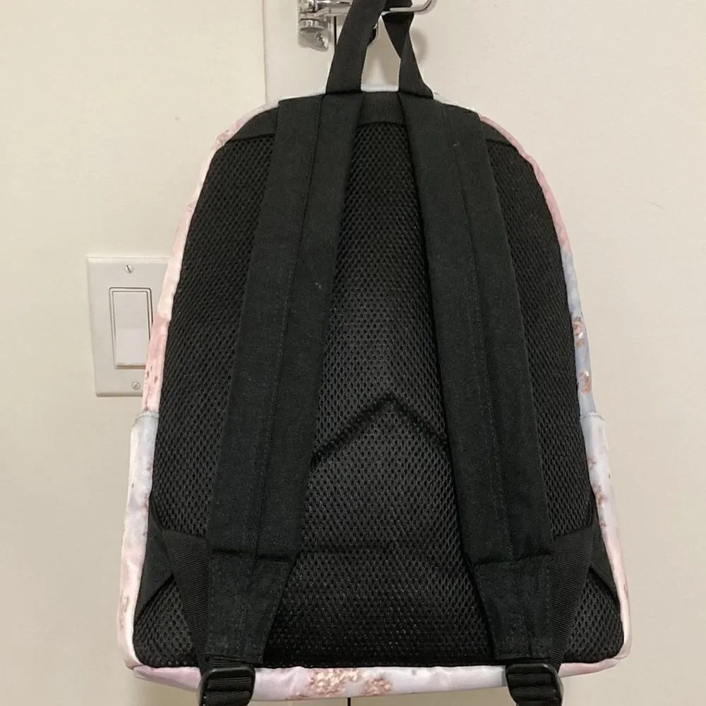 Yin Lang Nylon Backpack by Soundbyte in Pink & blue pattern.